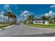 Entrance to Windsor Island Resort with palm trees and manicured landscaping at 2004 Summer Dr, Davenport, FL 33897