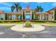 The community clubhouse welcomes residents with its gated entrance and manicured landscaping at 202 Stargrass Dr, Auburndale, FL 33823