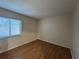 Bright bedroom featuring wood-look floors and a sunny window at 218 Perth Ct # A, Winter Springs, FL 32708