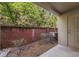 Backyard featuring gravel, an AC unit, a brick wall and some greenery at 248 Carina Cir, Sanford, FL 32773