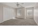 Neutral bedroom features plush carpeting, ceiling fan, and double door closet, creating a peaceful retreat at 248 Carina Cir, Sanford, FL 32773