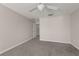 Empty bedroom offers plush carpeting, a ceiling fan, and a doorway to another room at 248 Carina Cir, Sanford, FL 32773