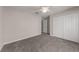 Neutral bedroom featuring carpet, closet, ceiling fan, and neutral walls at 248 Carina Cir, Sanford, FL 32773