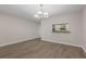 Bright dining room with wood floors, chandelier, and serving hatch to the kitchen at 248 Carina Cir, Sanford, FL 32773