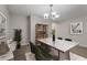 Elegant dining area featuring a marble table, modern furnishings, and stylish lighting at 248 Carina Cir, Sanford, FL 32773