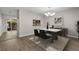 Chic dining room with a marble-top table, elegant chandelier, and modern decor at 248 Carina Cir, Sanford, FL 32773