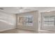 Bright living room with neutral walls, modern flooring, and natural light streaming through the windows at 248 Carina Cir, Sanford, FL 32773