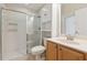 Bathroom with glass shower, wood cabinets, and sink at 2582 Greenwillow Dr, Orlando, FL 32825