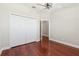 Bedroom with closet, wood floors, and white trim at 2582 Greenwillow Dr, Orlando, FL 32825