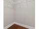 The closet features built-in shelving and hardwood floors at 2582 Greenwillow Dr, Orlando, FL 32825