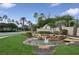 Community entrance featuring landscaping, a water feature, and community sign at 2582 Greenwillow Dr, Orlando, FL 32825