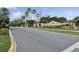 A view of the entrance featuring landscaping, a water feature, and community sign at 2582 Greenwillow Dr, Orlando, FL 32825