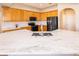 Modern kitchen featuring marble counters, stainless steel sink, and wooden cabinets at 2582 Greenwillow Dr, Orlando, FL 32825