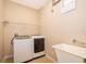 Laundry room with washer, dryer, and utility sink at 2582 Greenwillow Dr, Orlando, FL 32825