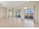 Bright living room featuring tile floors, neutral walls, and sliding glass doors to the outdoor area at 2582 Greenwillow Dr, Orlando, FL 32825