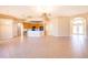 Spacious living room area featuring tile flooring and an open concept kitchen at 2582 Greenwillow Dr, Orlando, FL 32825