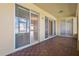 Screened in patio with view of living room, pavers, and sliding glass doors at 2582 Greenwillow Dr, Orlando, FL 32825