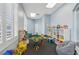 Cheerful playroom with plenty of natural light, toys, and colorful furniture at 2582 Greenwillow Dr, Orlando, FL 32825