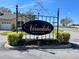 Entrance to the Verandahs, a deed-restricted community with manicured landscaping surrounding the elegant sign at 2634 Rutledge Ct, Winter Haven, FL 33884