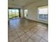 Bright living room with tile floors, and large sliding doors that provide lots of natural light at 2634 Rutledge Ct, Winter Haven, FL 33884