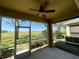 Screened in patio with ceiling fan and views of green lawn and sky at 2634 Rutledge Ct, Winter Haven, FL 33884