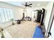 Bright exercise room with mirrors, weights and window with blinds for natural light at 2674 Kingsdale Dr, Deltona, FL 32738