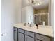 Bathroom with large mirror, spacious vanity, and shower at 3175 Feltrim Pl # 304, Kissimmee, FL 34747