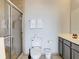 Bathroom with a tiled shower, white towels and commode at 3175 Feltrim Pl # 304, Kissimmee, FL 34747