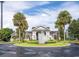 Elegant community entrance featuring a decorative fountain, manicured landscaping, and classic architectural design at 3175 Feltrim Pl # 304, Kissimmee, FL 34747