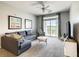 Spacious living room with carpet and natural light and view of balcony at 3175 Feltrim Pl # 304, Kissimmee, FL 34747