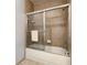 Shower stall featuring glass doors and neutral tile surround at 3175 Feltrim Pl # 304, Kissimmee, FL 34747