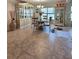 Cozy dining room with tile flooring, decorative cabinetry, and a glass-topped table at 3209 Casa Del Rey Ave, Kissimmee, FL 34746