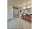 Spacious bathroom featuring double sinks, a shower/tub, and tile flooring at 3209 Casa Del Rey Ave, Kissimmee, FL 34746