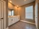 This bathroom features a double vanity, shower, and gray tile flooring at 345 Gardenia Ct, Kissimmee, FL 34759