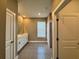 This bathroom features a double vanity, shower, and gray tile flooring at 345 Gardenia Ct, Kissimmee, FL 34759