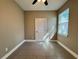 Bedroom with neutral walls, tiled floor, ceiling fan, and a window with blinds at 345 Gardenia Ct, Kissimmee, FL 34759