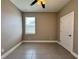 Bedroom with neutral walls, tiled floor, ceiling fan, and a window with blinds at 345 Gardenia Ct, Kissimmee, FL 34759