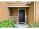 Front door with welcome sign and white railing at 3658 Caruso Pl, Oviedo, FL 32765