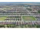 Aerial shot of a residential neighborhood with community green spaces and water views at 411 Lazio Cir, Debary, FL 32713