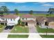 Aerial view of a home with well-kept lawn near a picturesque lake at 411 Lazio Cir, Debary, FL 32713