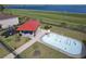 Aerial view of neighborhood splashpad featuring a covered seating area and playground at 411 Lazio Cir, Debary, FL 32713