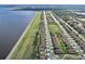 Aerial view of residential area near lake, showcasing street layout and landscaping at 411 Lazio Cir, Debary, FL 32713