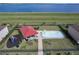 Aerial view of community splashpad and playground area next to a lake at 411 Lazio Cir, Debary, FL 32713