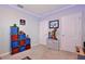 Organized bedroom featuring a storage cube and movie and gaming decorations at 411 Lazio Cir, Debary, FL 32713