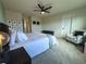 Primary bedroom featuring a ceiling fan, neutral colors, and carpet at 5017 Blue Hammock Ct, Kissimmee, FL 34746