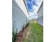 Side yard features fresh mulch, and landscaping providing additional outdoor space at 5017 Blue Hammock Ct, Kissimmee, FL 34746