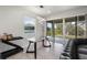 Bright dining area with modern table and chairs, access to the patio through sliding glass doors at 5315 Meadow Song Dr, Okahumpka, FL 34762