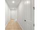 Hallway with neutral tile floors and white walls at 5315 Meadow Song Dr, Okahumpka, FL 34762