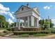 Elegant community entrance with brick signage, columns, and manicured landscaping at 5376 Dagenham Dr, Davenport, FL 33837