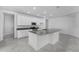 Well-equipped kitchen showcasing white cabinetry, a center island, and sleek countertops at 5376 Dagenham Dr, Davenport, FL 33837